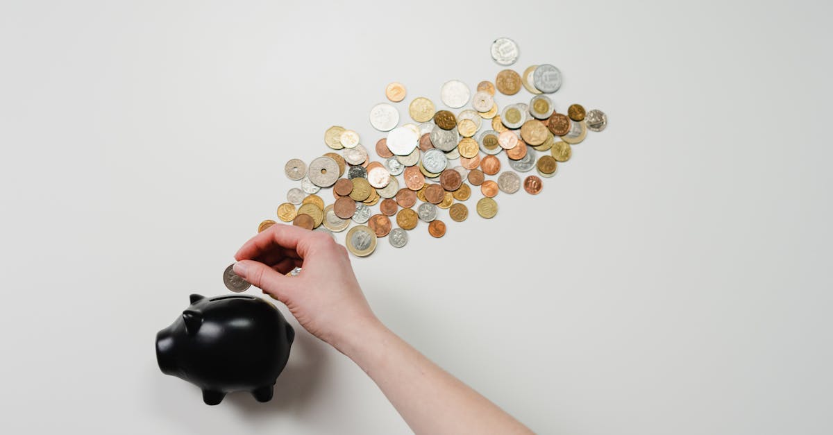 Parent and child counting coins at kitchen table